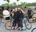 Bicyclists, adults and children, their portraits