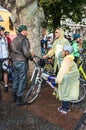 Bicyclists, adults and children, their portraits