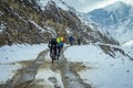 Bicyclists Biking on Snowy Road