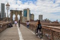 Bicyclists and pedestrians crossing empty Brooklyn Bridge during the coronavirus COVID-19 pandemic lockdown in New York City Royalty Free Stock Photo