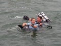 BIDEFORD, DEVON, ENGLAND - JULY 24 2022: Participants in annual Water Festival Cardboard Boat Race, River Torridge