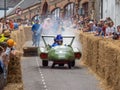 BIDEFORD, DEVON, ENGLAND - JUNE 18 2023: Participant emitting smoke in the annual Soapbox Derby fun race event in the