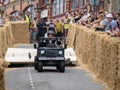 BIDEFORD, DEVON, ENGLAND - JUNE 18 2023: Wheelcaps coming off participant in the annual Soapbox Derby fun race event.