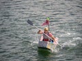 BIDEFORD, DEVON - JUNE 11 2023: Participant in the annual Cardboat Boat Race on the River Torridge.