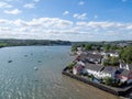 BIDEFORD, DEVON, UK - MAY 11 2020: Hide tide on River Torridge. Houses inside flood defences. Residential development.