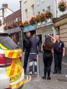 BIDEFORD, NORTH DEVON - AUGUST 6 2020: Armed police close Mill St, a major shopping street after reports of armed man in