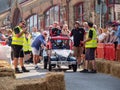 BIDEFORD, NORTH DEVON, ENGLAND - SEPTEMBER 5 2021: The Soapbox Derby. Here, a team stand with gokart at the starting