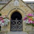 St George`s Church and Village Cottages in the village of Georgham near Croyde on the North Devon coast AONB, Devon, UK Royalty Free Stock Photo