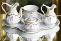Victorian antique porcelain coffee service in gold and white Royalty Free Stock Photo