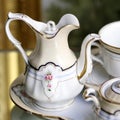 Victorian antique porcelain coffee service in gold and white Royalty Free Stock Photo