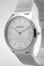 Biel, Switzerland 31.03.2020 - The closeup of CALVIN KLEIN man white clock face dial stainless steel bracelet swiss Royalty Free Stock Photo