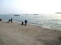 Biennial Venice 2017 Artist painting a painting in front of the sea in Venice ItalyGiardini della Biennale Venice Italy Europe