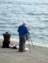 Biennial Venice 2017 Artist painting a painting in front of the sea in Venice ItalyGiardini della Biennale Venice Italy Europe