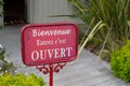 Bienvenue entrez c`est ouvert means in french welcome come in it`s open boutique sign board on store entrance shop