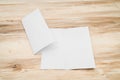 Bifold white template paper on wood