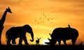 Big African Animals Silhouette on field At Beautiful Sunset Sky. Rhinoceros, Elephant and Giraffe