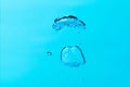 Big air bubble on blue water ,isolated on blue background Royalty Free Stock Photo