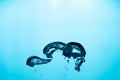 Big air bubble are rising in the blue water , air bubble isolated on blue background. Royalty Free Stock Photo