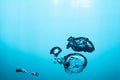 Big air bubble are rising in the blue water , air bubble isolated on blue background Royalty Free Stock Photo