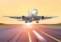 Big airplane in motion take off the evening sky sunset sunrise sun airport Royalty Free Stock Photo