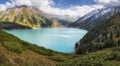 Big Almaty Lake in Tien Shan mountains of Kazakhstan. Panorama of Beautiful mountain landscape on a fall evening Royalty Free Stock Photo