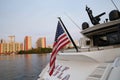 American flag on a yacht on the water against the background of skyscrapers in Miami Royalty Free Stock Photo
