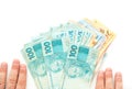 Brazilian money, reais, high denominations held in the palm of your hand Royalty Free Stock Photo