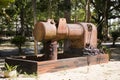 Big ancient water pump in garden of Wat Kiean Bang Kaew