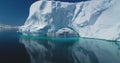 Big Antarctic iceberg arch float turquoise water