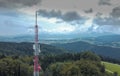 Big antenna mast for 3G, 4G and 5G repeater in the middle of the forest or nature. Controversial tehnology in the wild nature.