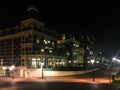 Big apartments complex building with city street road and lighted lampposts in the popular town scheveningen the Netherlands Royalty Free Stock Photo