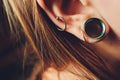 The big aperture in an ear at the teenager. Royalty Free Stock Photo