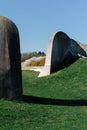 Big arch stone wall on the green field Royalty Free Stock Photo