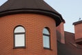 big attic of a red brick private house with a windows Royalty Free Stock Photo