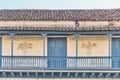 Big balcony with wooden railings of colonial Spanish style house in historic center Trinidad, Cuba Royalty Free Stock Photo