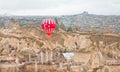 Big balloon over the abandoned village of colorful rock valley Royalty Free Stock Photo