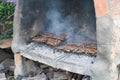 Big barbacue with two cooking grids with lamb chops and pork secret Royalty Free Stock Photo