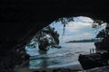 Big beach rock hole scene with blue sky