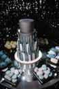 big beautiful black wedding cake stands on a table close up Royalty Free Stock Photo