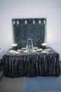 big beautiful black wedding cake stands on a table close up Royalty Free Stock Photo
