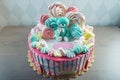 Kids cake decorated with Teddy bear and colorful meringues, marshmallows. Concept of desserts for the birthday children Royalty Free Stock Photo