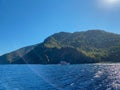 Big beautiful tropical paradise island with mountains, plants and trees green and blue salty warm sea Royalty Free Stock Photo