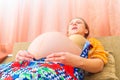 Big belly of a pregnant woman, bottom view wide-angle photo