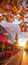 Big Ben against colorful sunset with red bus during autumn in London, England Royalty Free Stock Photo