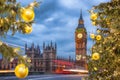 Big Ben with Christmas tree on bridge in the evening, London, England, United Kingdom Royalty Free Stock Photo