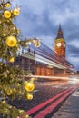 Big Ben with Christmas tree on bridge at night in London, England, United Kingdom Royalty Free Stock Photo