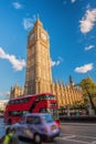 Big Ben with double decker bus on the busy street in London, England, UK Royalty Free Stock Photo