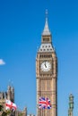 Big Ben with flags of England in London, UK Royalty Free Stock Photo