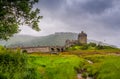 Looking out to Eilean Donan Castle, where three sea lochs meet, Loch Duich, Loch Long and Loch Alsh, on an overcast day in the Sco Royalty Free Stock Photo