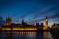 Big Ben and the Houses of Parliament at night from across the river Thames and Westminster bridge southbank in London, England, UK Royalty Free Stock Photo